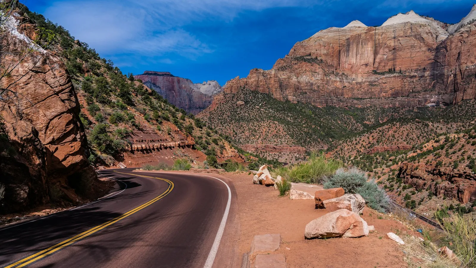 Scenic road between sandstone cliffs in Zion National Park